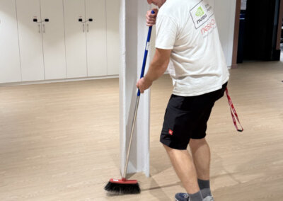 nesevo technician sweeping the floor after installation work